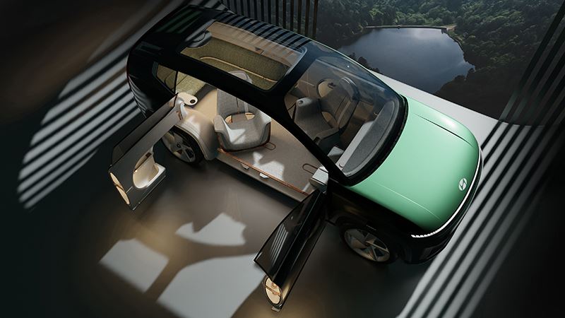 Voorin de concept car SEVEN van Hyundai bevinden zich twee fauteuil-achtige stoelen en achterin een hoekbank.